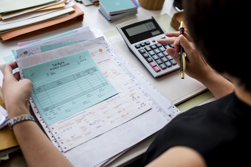 Managing invoices, payment records, and billing documents manually