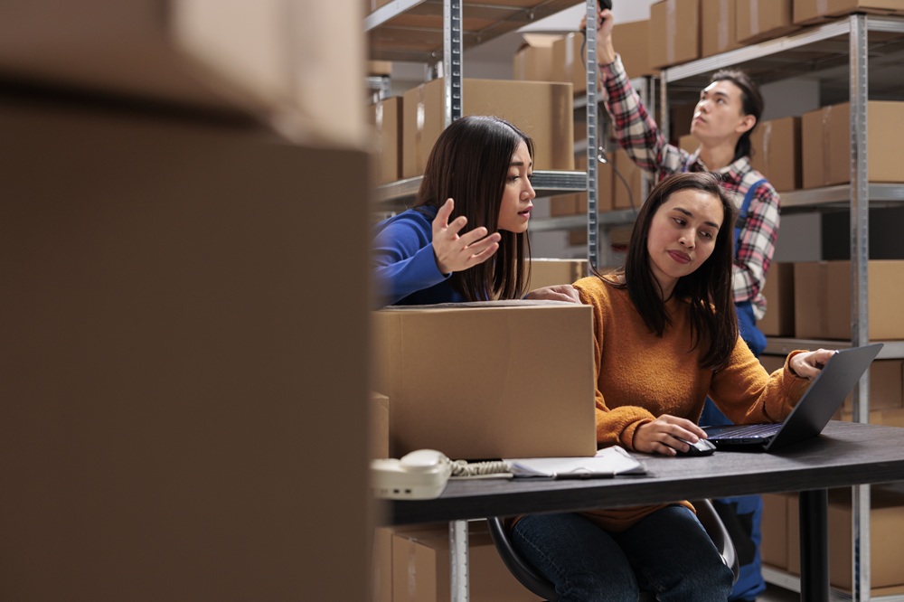 Warehouse team investigating inventory discrepancies and stock count inaccuracies